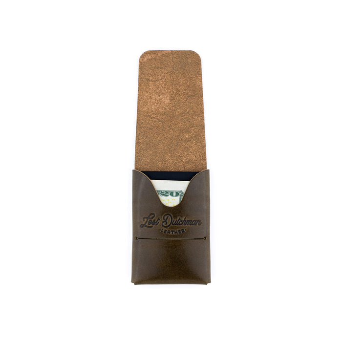 Brown leather wallet with cork interior on a white background