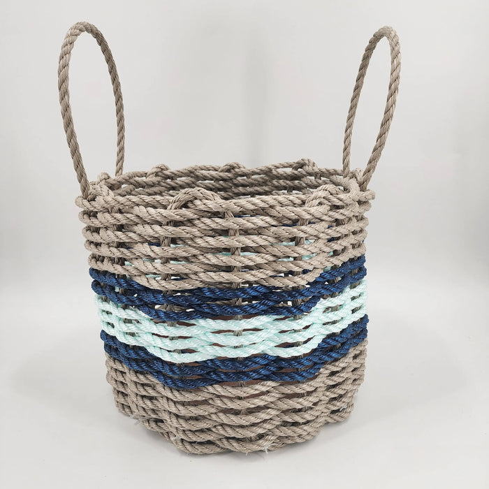 Woven basket with striped pattern on a white background