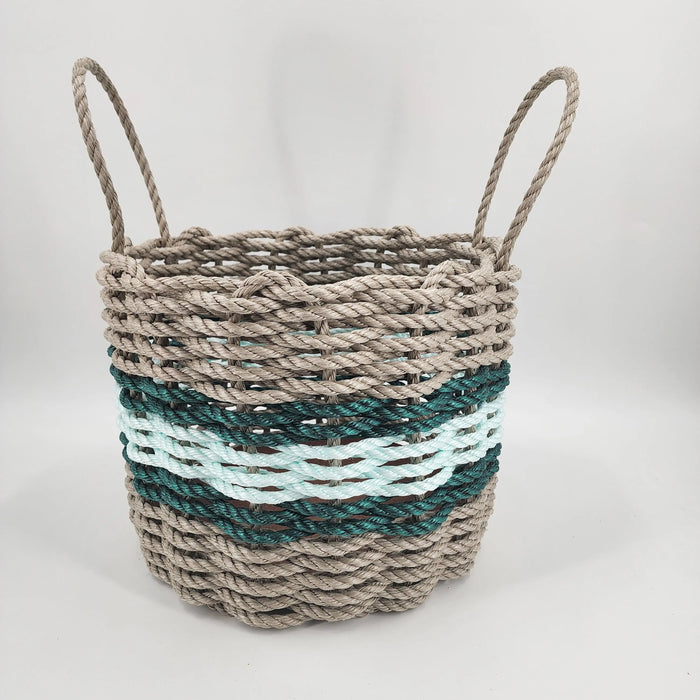 Woven basket with striped pattern on a white background