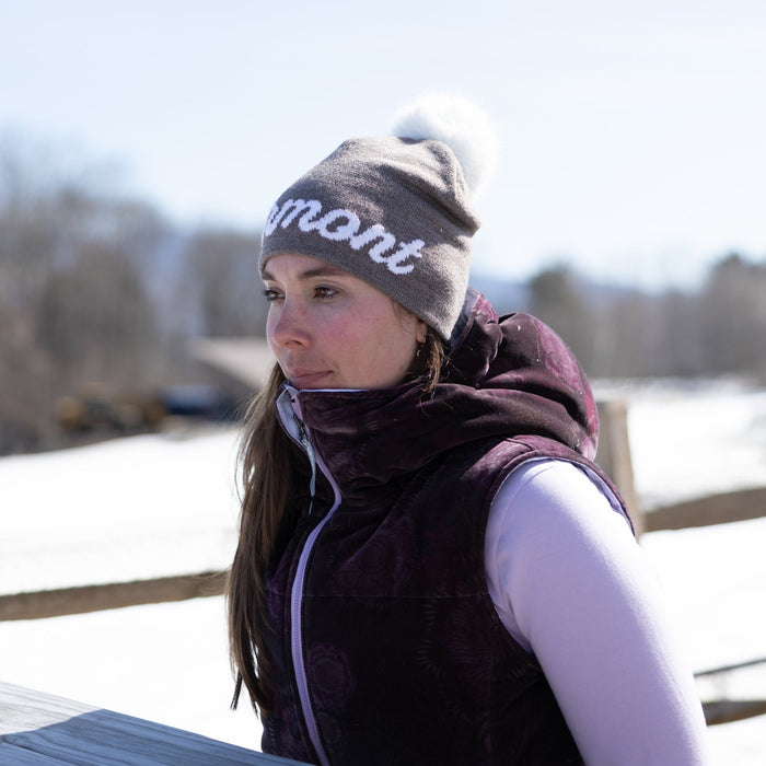 Person wearing a winter hat and jacket outdoors