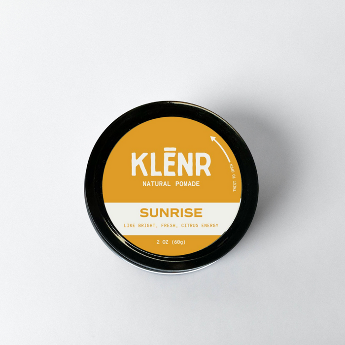 Klénr natural pomade container with 'Sunrise' flavor on a white background