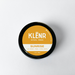 Klénr natural pomade container with 'Sunrise' flavor on a white background
