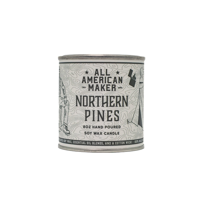 Candle container labeled 'All American Maker Northern Pines' on a white background