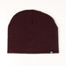 Red beanie with a small logo on a white background
