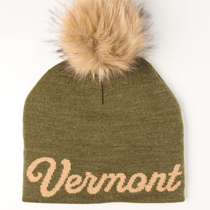 Green beanie with 'Vermont' text and fur pom-pom on a white background