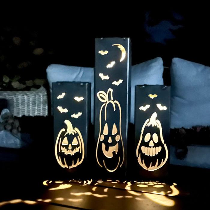 Decorative Halloween lights with pumpkin designs on a dark background
