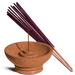 Terracotta incense burner with a single incense stick and purple incense sticks on a white background