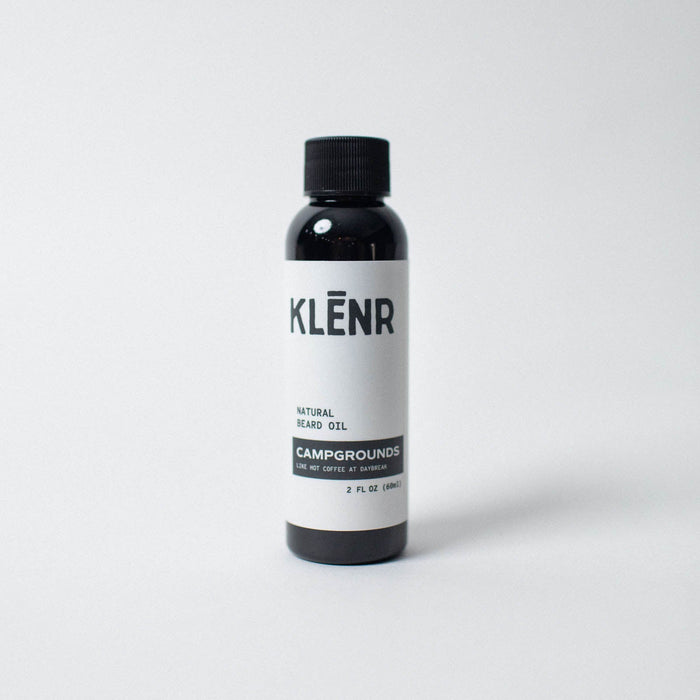 Bottle of KLénr natural bears oil on a white background