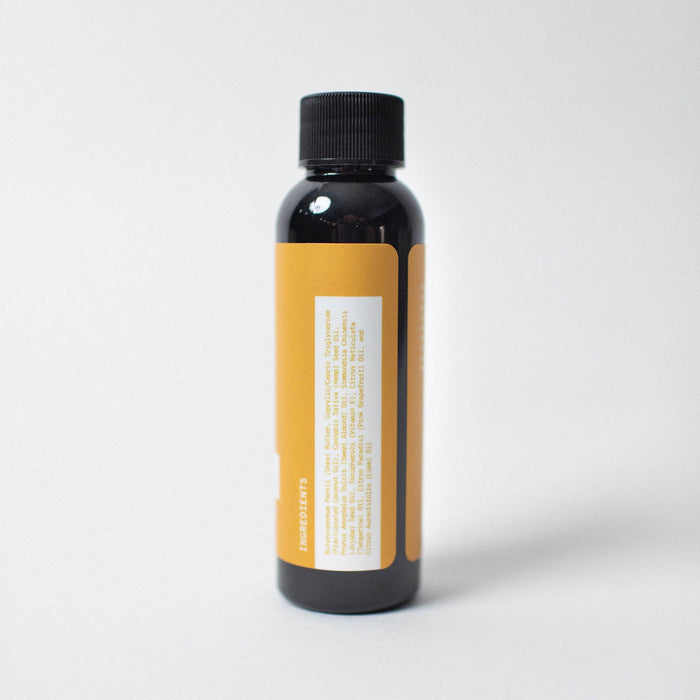 Black bottle with a yellow label on a white background