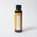Black bottle with a yellow label on a white background