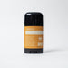Deodorant stick with an orange label on a white background