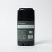 Black deodorant stick with a label on a white background