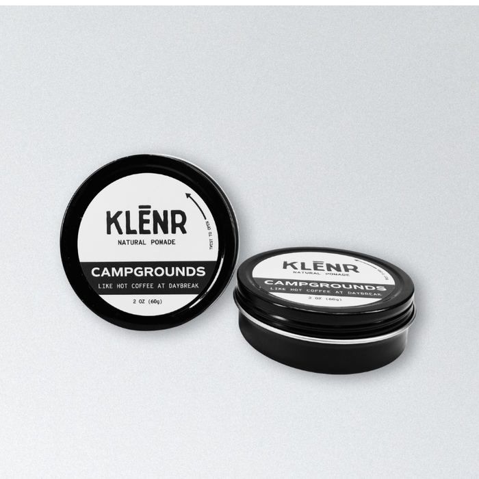 Two containers of Klenr natural pomade on a light gray background