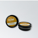 Two containers of Klénr Sunrise natural pomade on a white background