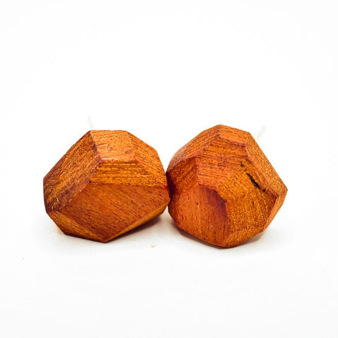 Two wooden geometric shapes on a white background